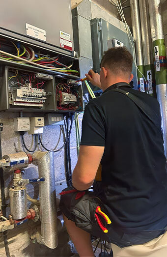 Local Emergency Technician Repairing Switchboard